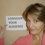 Sherry Truhlar with Consider Your Audience sign