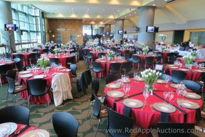 Diana Vreeland-inspired auction luncheon with red tablecloths