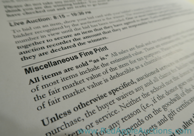 Fundraising Auction rules presented as fine print