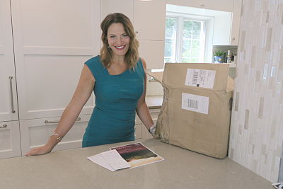 Female auctioneer Sherry Truhlar in kitchen